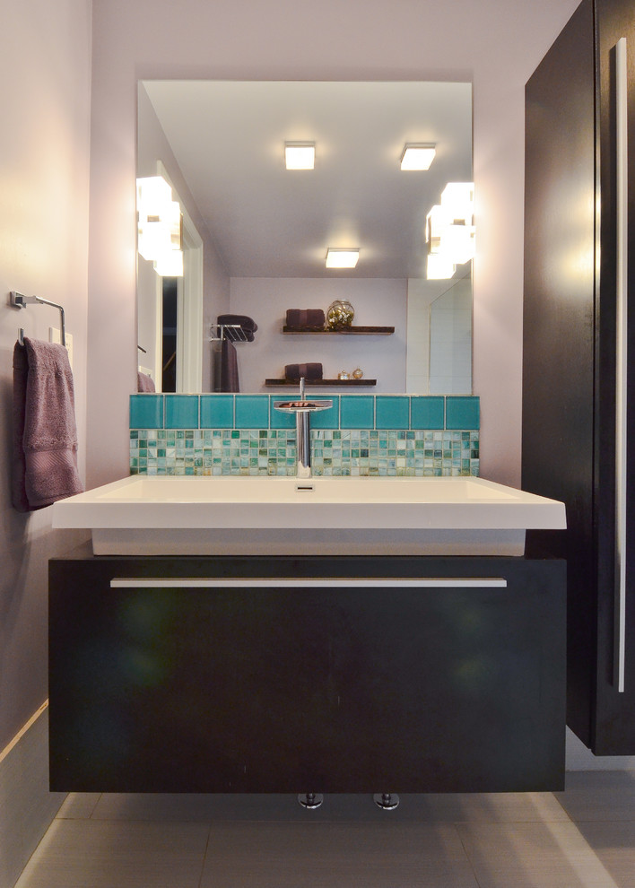 Design ideas for a small eclectic master bathroom in Boston with an integrated sink, flat-panel cabinets, dark wood cabinets, a drop-in tub, an open shower, a two-piece toilet, green tile, glass tile, purple walls and porcelain floors.