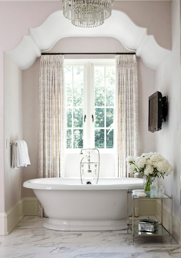 This is an example of a traditional master bathroom in Atlanta with a freestanding tub.