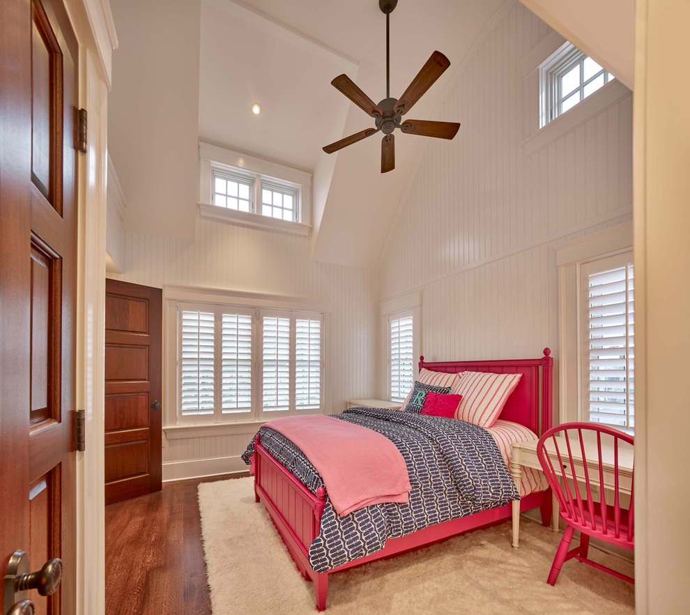 This is an example of a mid-sized beach style guest bedroom in Philadelphia with white walls, medium hardwood floors, no fireplace and brown floor.