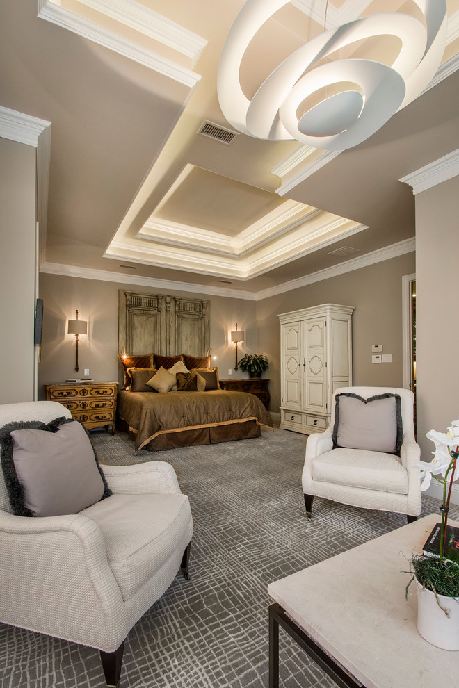 Inspiration for a large transitional master bedroom in Dallas with beige walls and carpet.