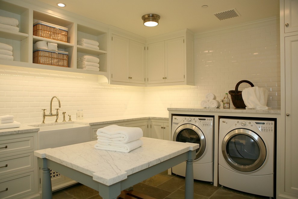 Traditional laundry room in Los Angeles with a farmhouse sink and white benchtop.