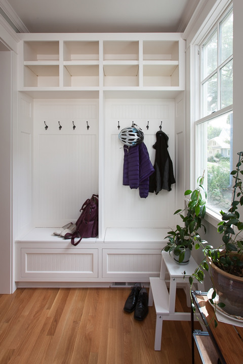 Example of a small transitional light wood floor and beige floor front door design in Orange County with gray walls