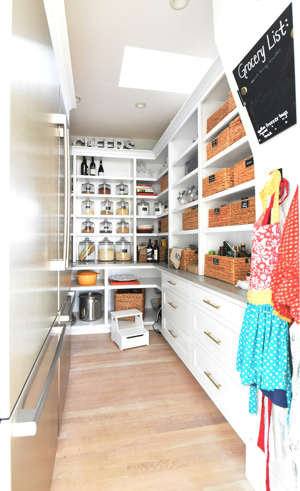 Inspiration for a mid-sized craftsman galley light wood floor kitchen pantry remodel in Other with shaker cabinets, white cabinets, quartz countertops, white backsplash, stainless steel appliances, no island and gray countertops