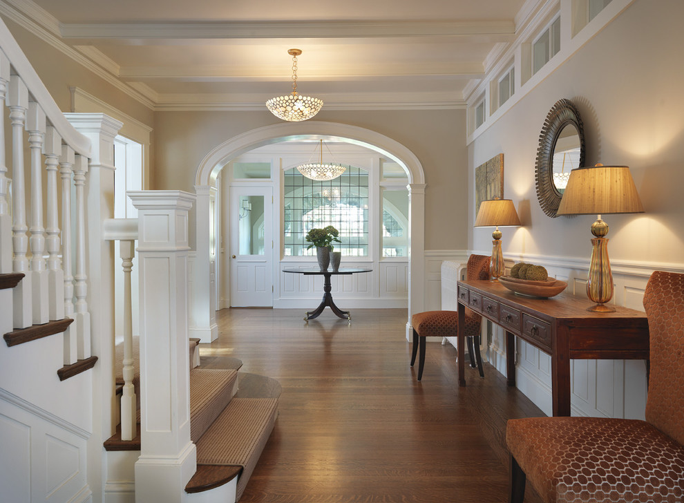 Photo of a traditional foyer in Boston with grey walls, medium hardwood floors, a single front door and a glass front door.