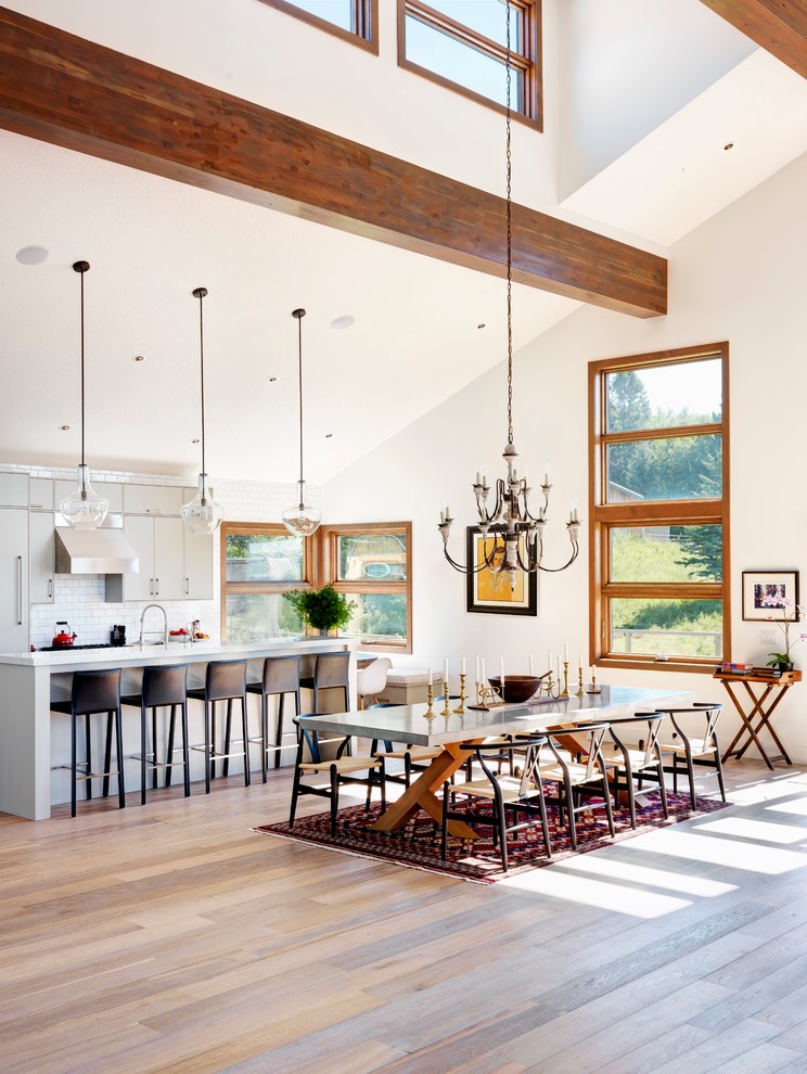 Design ideas for an expansive country kitchen/dining combo in Calgary with white walls and light hardwood floors.