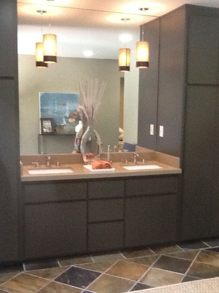 Example of a mid-sized transitional master beige tile, brown tile and travertine tile travertine floor and beige floor bathroom design with flat-panel cabinets, dark wood cabinets, beige walls, an undermount sink and quartz countertops