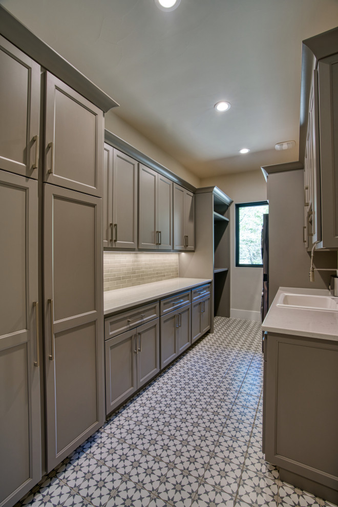 Transitional laundry room photo in Austin