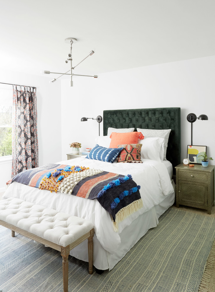 This is an example of an eclectic guest bedroom in Nashville with white walls.
