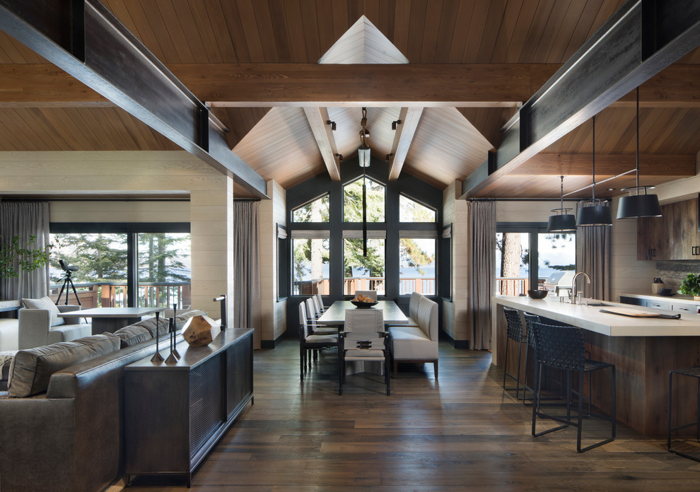 This is an example of a country open plan dining in San Francisco with bamboo floors and brown floor.