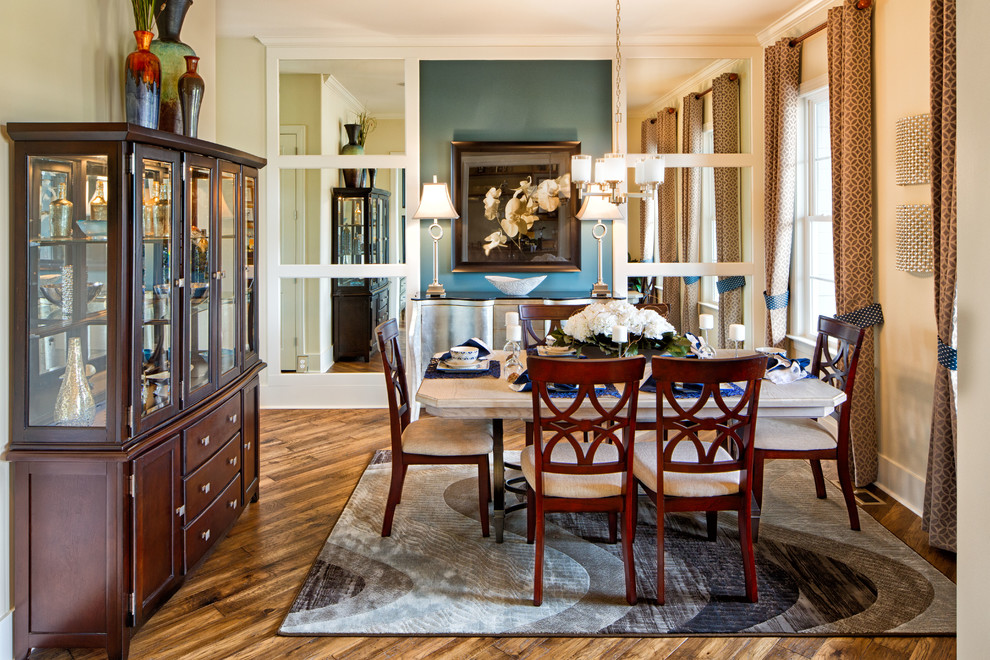Inspiration for a traditional dining room in Cleveland with beige walls and dark hardwood floors.
