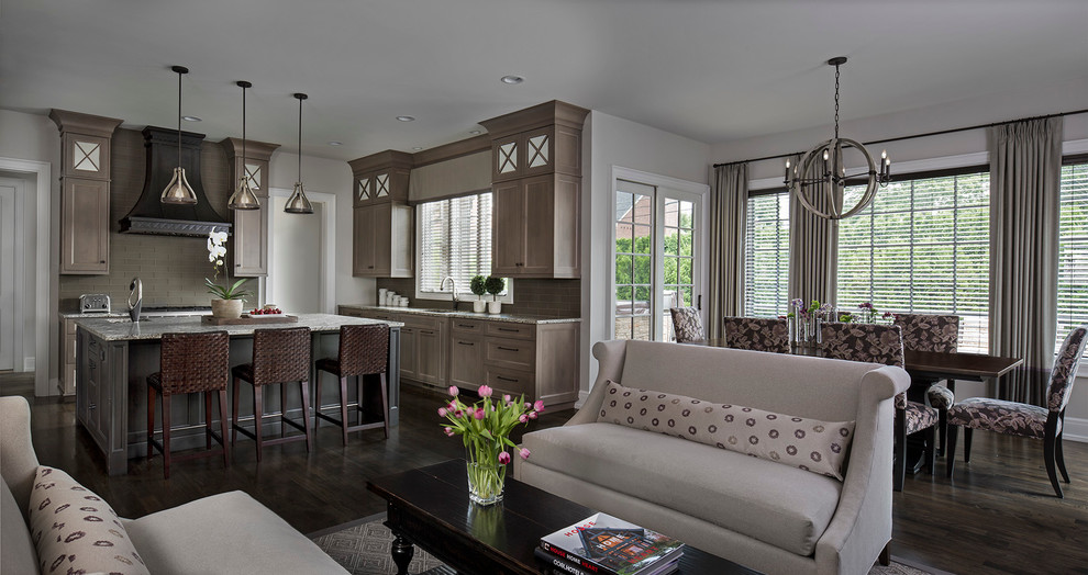 Inspiration for a huge transitional dark wood floor open concept kitchen remodel in Detroit with flat-panel cabinets, gray cabinets, gray backsplash, subway tile backsplash, stainless steel appliances and an island