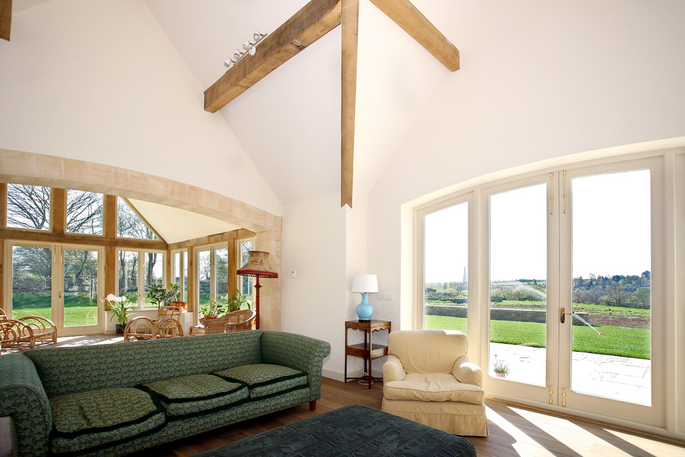 Inspiration for an arts and crafts sunroom in Oxfordshire with medium hardwood floors and a standard ceiling.