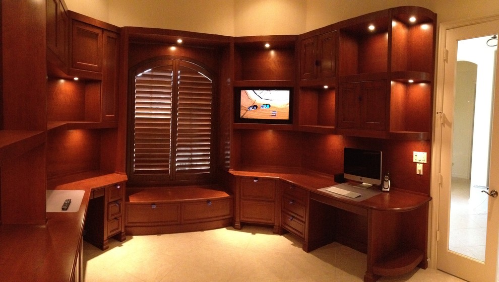This is an example of a large transitional study room in Miami with beige walls, a built-in desk, ceramic floors, no fireplace and beige floor.