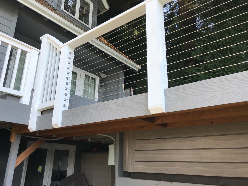 Example of a mid-sized transitional backyard deck design in Seattle with no cover