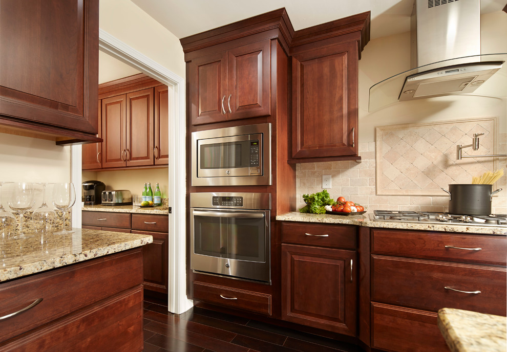 Inspiration for a large modern u-shaped kitchen pantry in Atlanta with dark wood cabinets, with island, stainless steel appliances, dark hardwood floors, an undermount sink, shaker cabinets, granite benchtops, brown splashback and cement tile splashback.