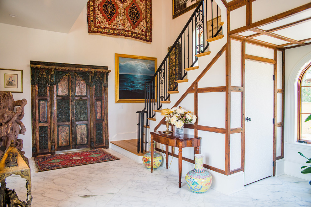 Photo of a mid-sized traditional entryway in Nashville with white walls, marble floors, a double front door, a dark wood front door and grey floor.