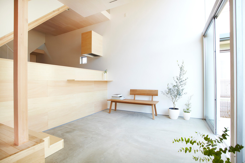 Photo of a contemporary living room in Tokyo with white walls and no fireplace.