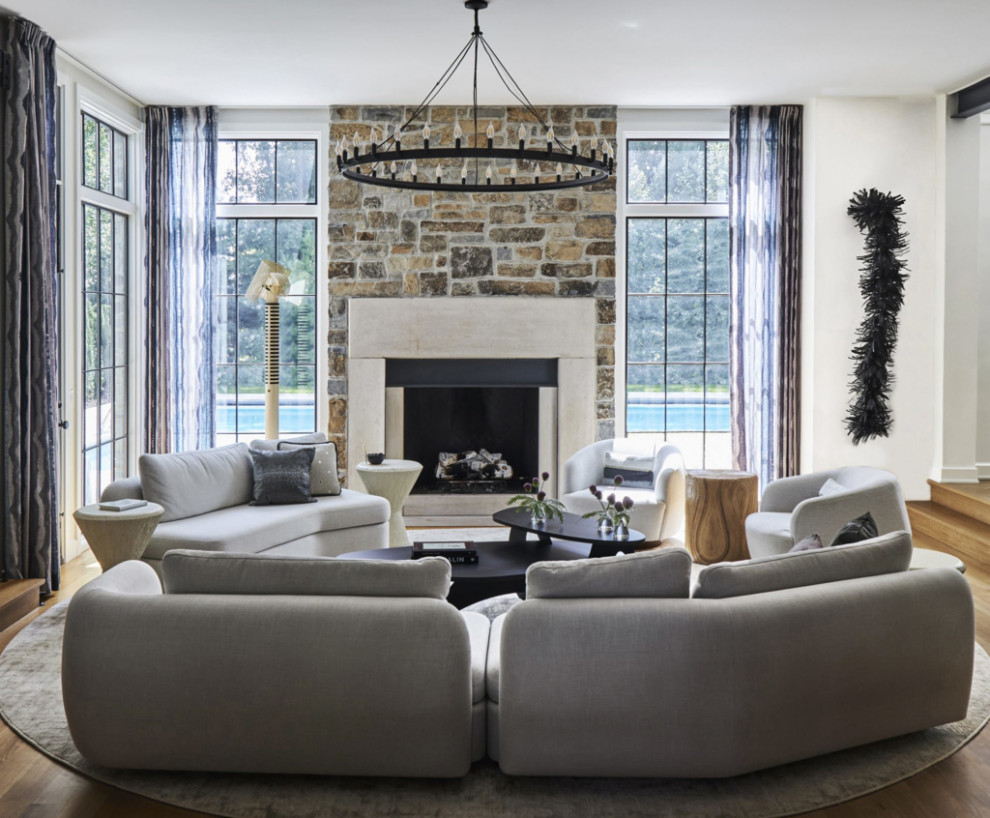 Mid-sized trendy formal and open concept light wood floor, brown floor, shiplap ceiling and wall paneling living room photo in New York with white walls, a standard fireplace, a stacked stone fireplace and a wall-mounted tv