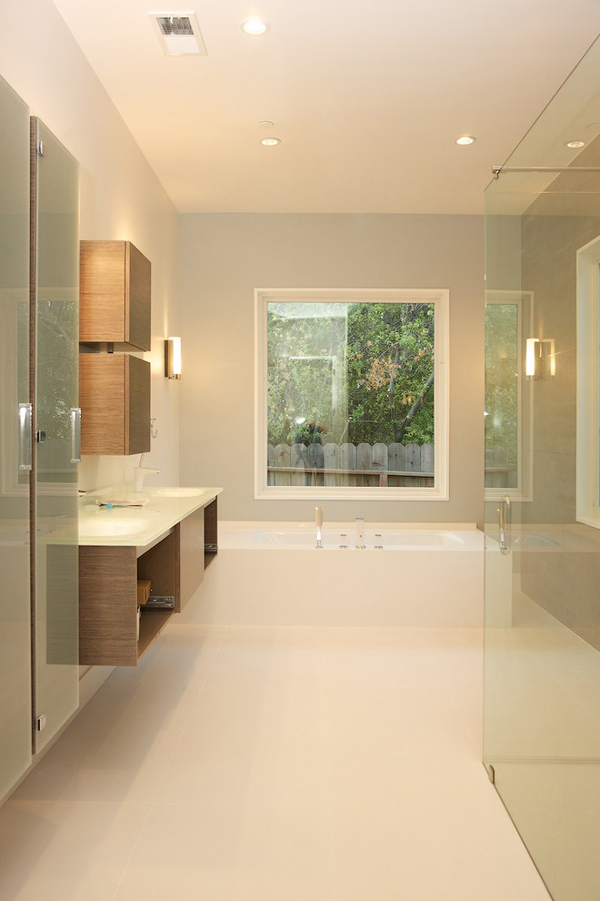 This is an example of a contemporary bathroom in San Francisco with an integrated sink, open cabinets, medium wood cabinets, beige tile and white benchtops.