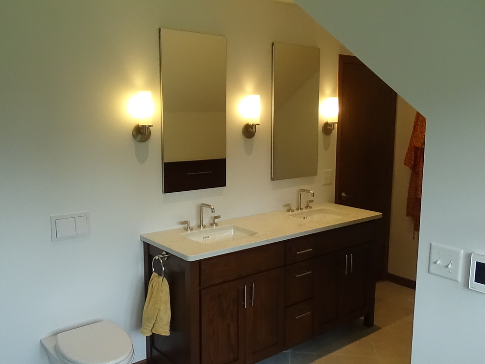 Freestanding bathtub - mid-sized transitional master white tile and ceramic tile porcelain tile and beige floor freestanding bathtub idea in Chicago with recessed-panel cabinets, medium tone wood cabinets, a wall-mount toilet, white walls, an undermount sink, quartz countertops, a hinged shower door and white countertops