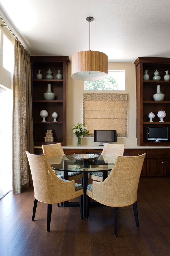 Photo of a contemporary dining room in Los Angeles with beige walls and dark hardwood floors.