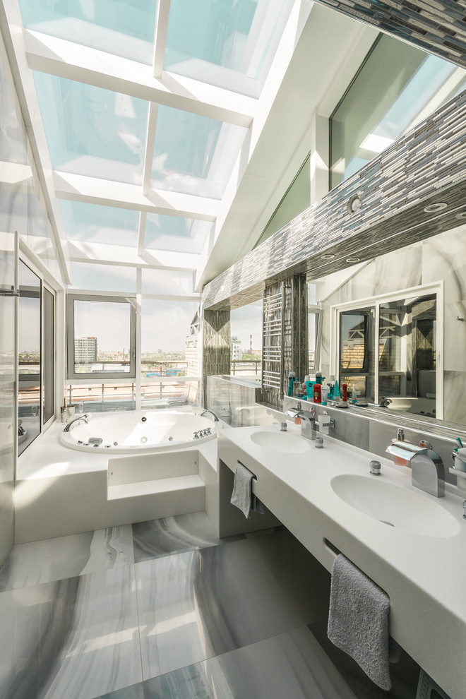 Contemporary master bathroom in Saint Petersburg with flat-panel cabinets, a hot tub and an integrated sink.