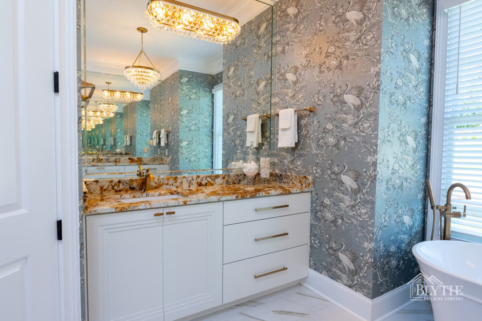 This is an example of a large arts and crafts master bathroom in Other with flat-panel cabinets, white cabinets, a freestanding tub, multi-coloured walls, marble floors, a drop-in sink, multi-coloured floor, multi-coloured benchtops, a niche, a double vanity, a built-in vanity and wallpaper.