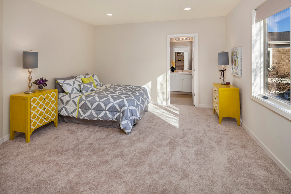 Design ideas for a mid-sized contemporary guest bedroom in Seattle with beige walls, carpet and a standard fireplace.