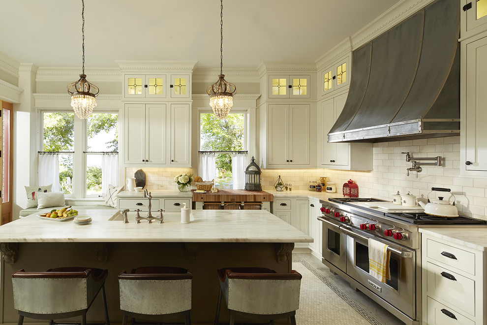 Design ideas for a large traditional l-shaped separate kitchen in Atlanta with a farmhouse sink, shaker cabinets, white cabinets, marble benchtops, white splashback, porcelain splashback, stainless steel appliances, marble floors and with island.