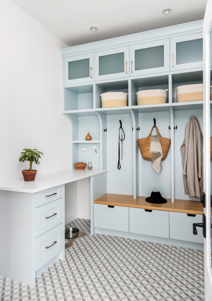 Transitional multicolored floor mudroom photo with white walls