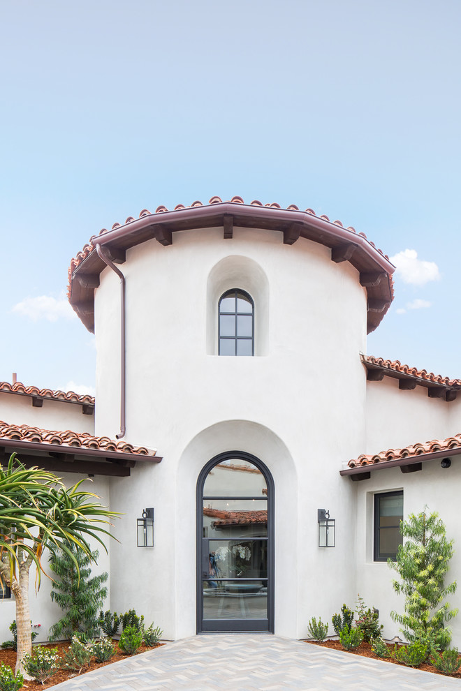 We Game to Please - Tuscan home design photo in San Diego