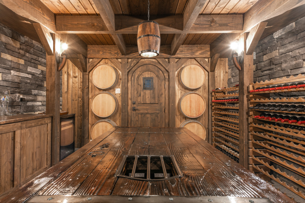 Photo of a mid-sized arts and crafts wine cellar in Seattle with porcelain floors, storage racks and blue floor.