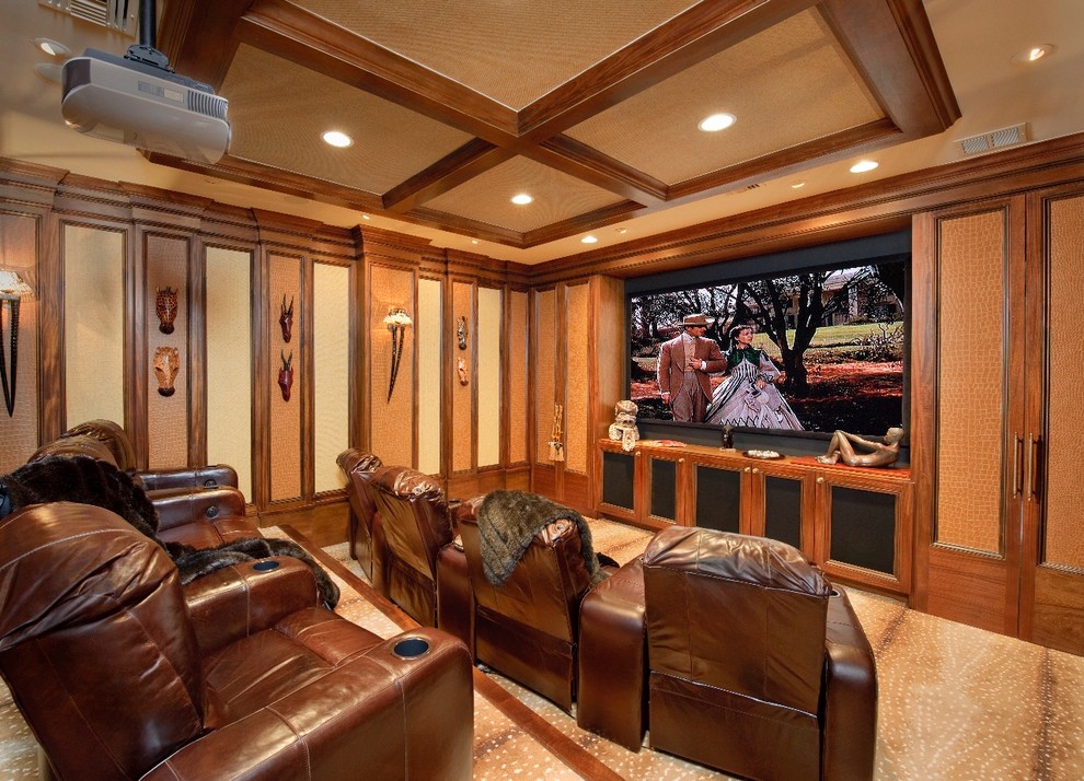 Inspiration for a mediterranean home theatre in Houston with a projector screen.