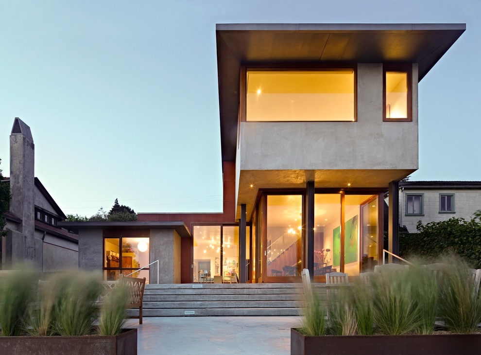 Design ideas for a mid-sized modern two-storey concrete grey house exterior with a flat roof.