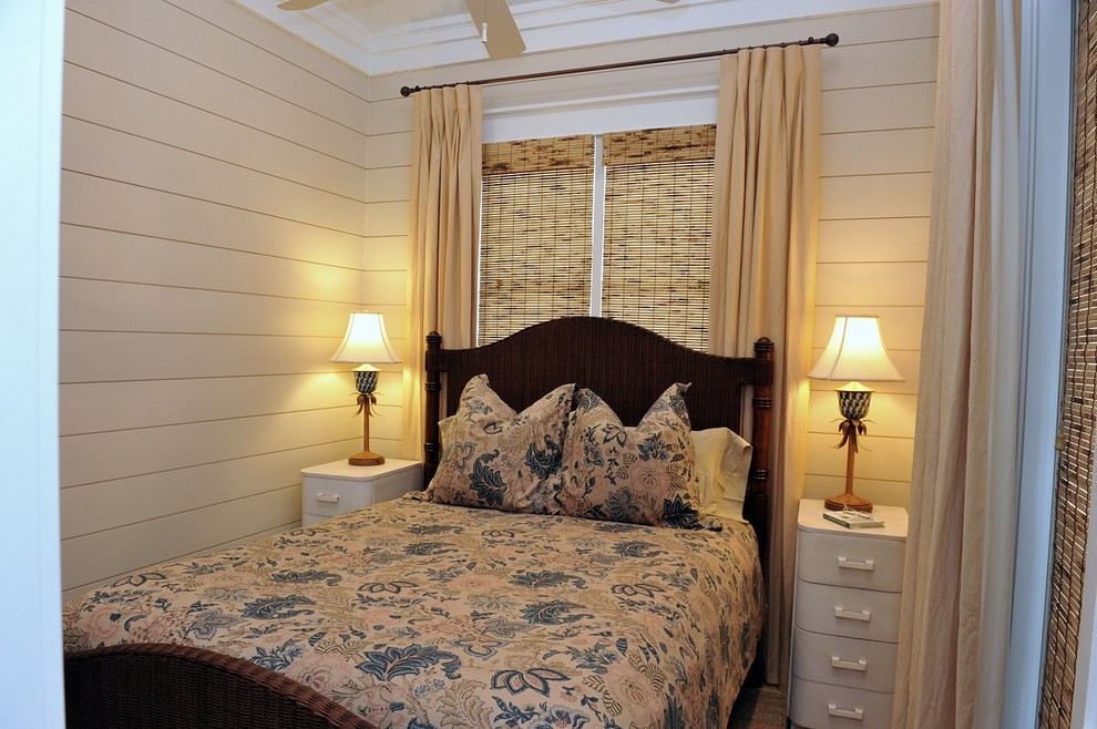Photo of a mid-sized beach style guest bedroom in Miami with beige walls.
