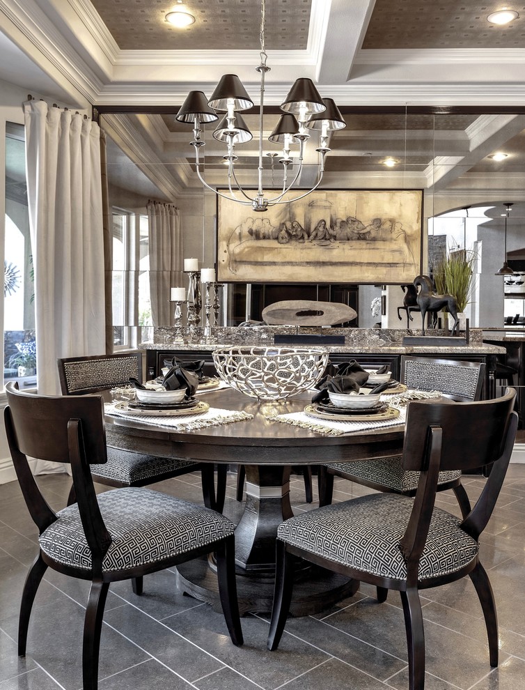 This is an example of a transitional dining room in Las Vegas with grey floor.