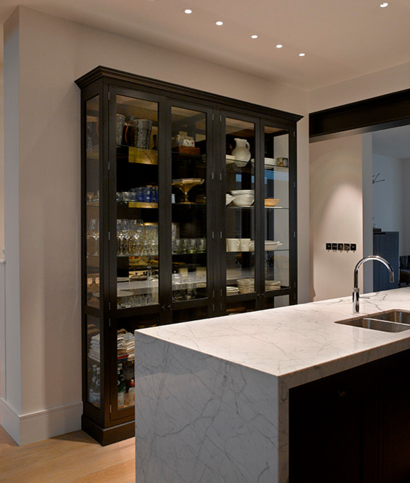 Photo of a large contemporary galley eat-in kitchen in London with recessed-panel cabinets, green cabinets, marble benchtops, white splashback, marble splashback, with island and white benchtop.
