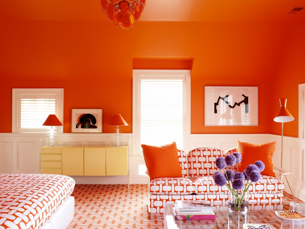 This is an example of a transitional bedroom in New York with orange walls, carpet and orange floor.