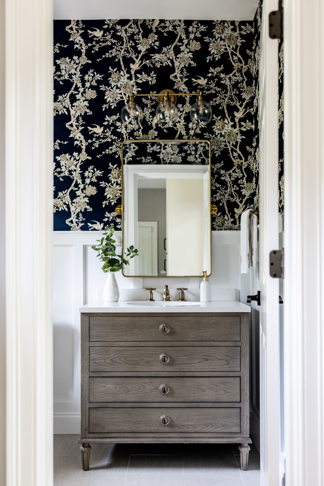 Mid-sized transitional porcelain tile, beige floor and wall paneling powder room photo in Boston with a freestanding vanity