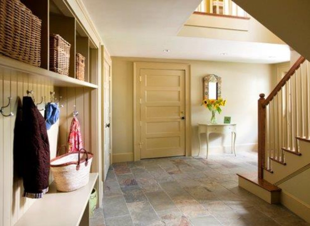 Photo of a mid-sized country mudroom in Boston with yellow walls, slate floors, a single front door, a yellow front door and multi-coloured floor.