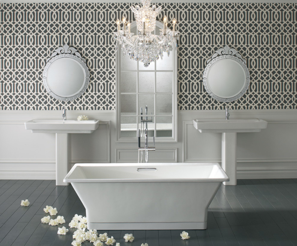 Design ideas for a large traditional master bathroom in Milwaukee with a pedestal sink, a freestanding tub, white tile, wood-look tile, black walls and dark hardwood floors.