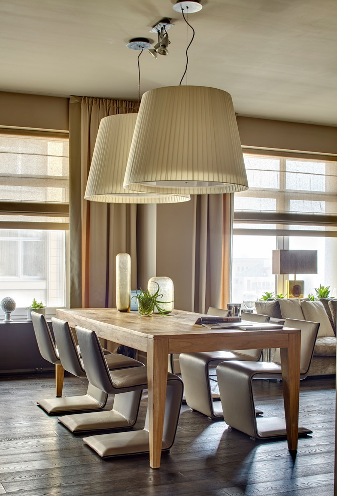Design ideas for a contemporary dining room in Saint Petersburg with beige walls, dark hardwood floors and brown floor.