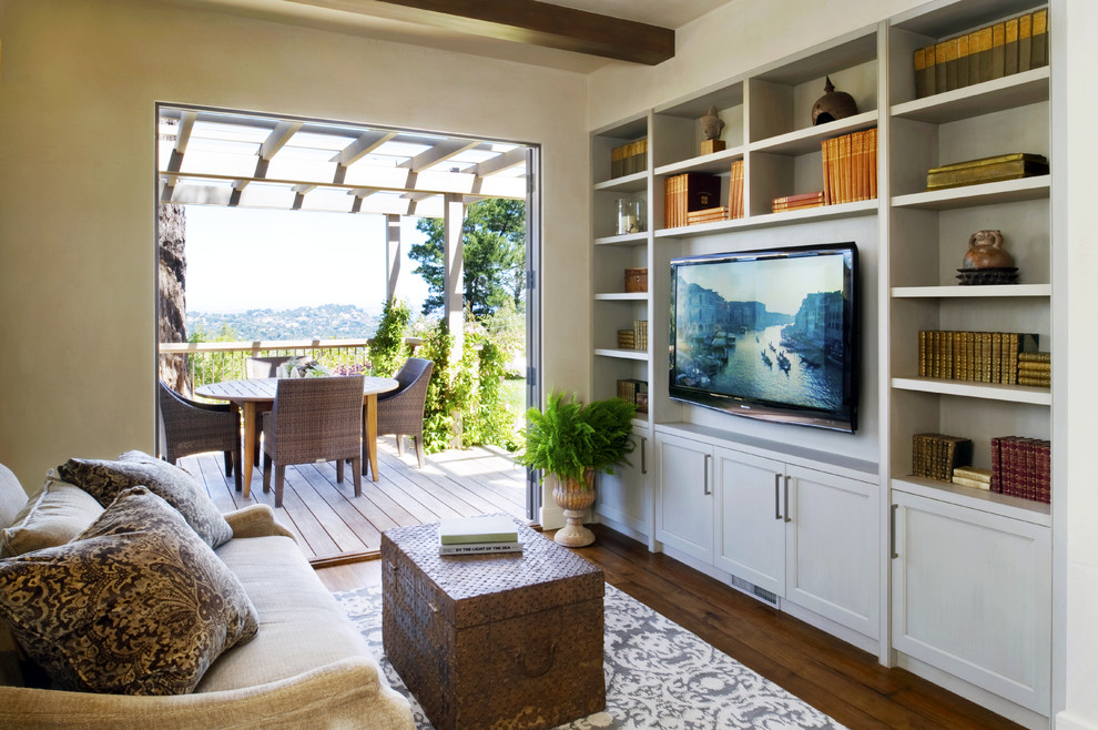 Photo of a transitional family room in San Francisco with beige walls, dark hardwood floors and a wall-mounted tv.