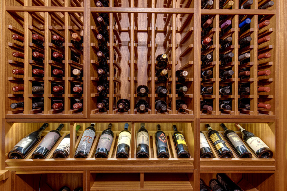 Secret passageway wine cellar. Basement layout with all mahogany racking.