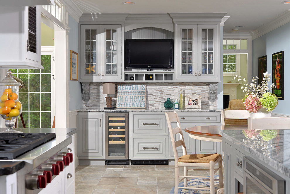 Beach style eat-in kitchen in Boston with raised-panel cabinets, grey cabinets and stainless steel appliances.