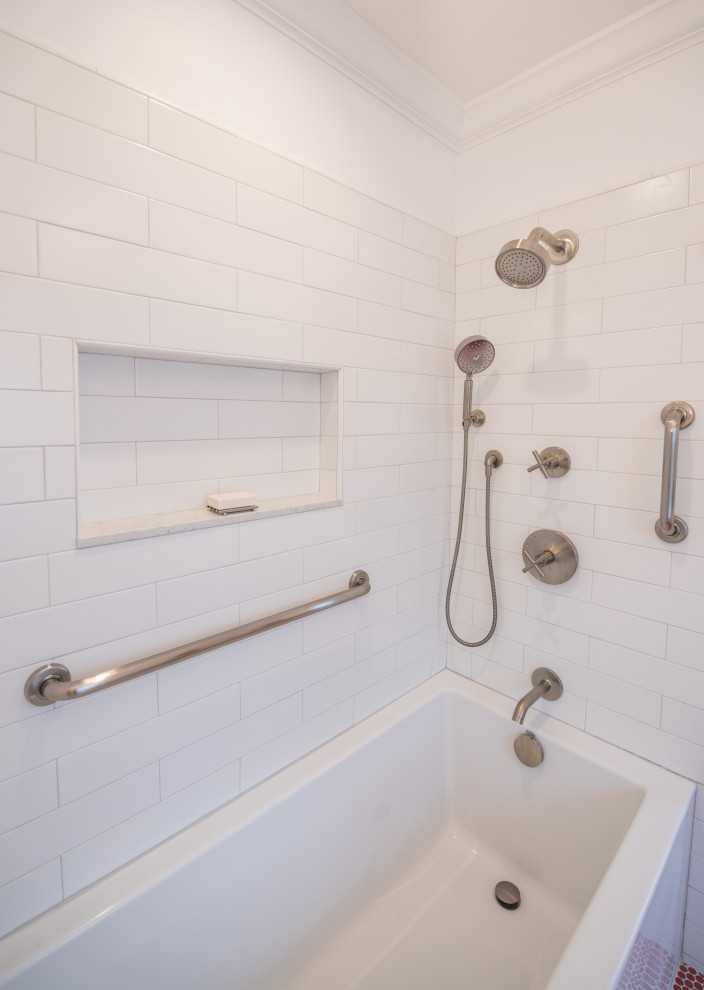 Photo of a medium sized eclectic ensuite bathroom in Bridgeport with white cabinets, an alcove bath, a shower/bath combination, a two-piece toilet, ceramic flooring, a submerged sink, solid surface worktops, red floors, a shower curtain, white worktops, a wall niche, double sinks and a built in vanity unit.