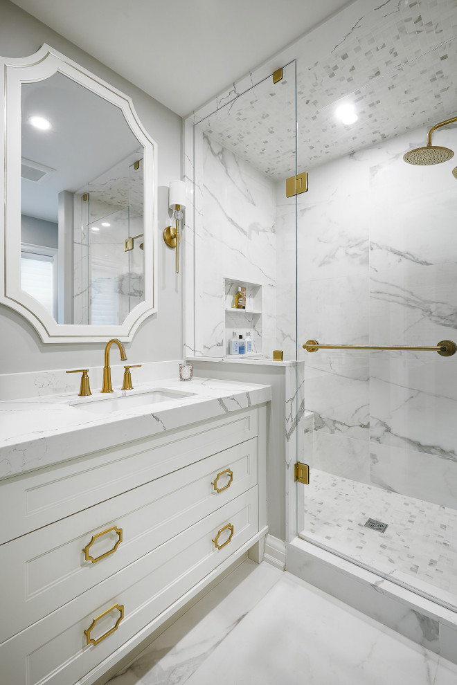 Mid-sized transitional 3/4 white tile white floor and single-sink bathroom photo in Toronto with recessed-panel cabinets, white cabinets, an undermount sink, a hinged shower door, white countertops and a built-in vanity
