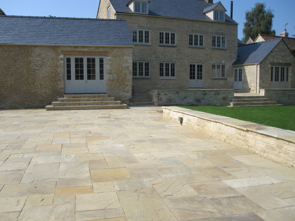 Design ideas for a large country garden in Berkshire with natural stone pavers.