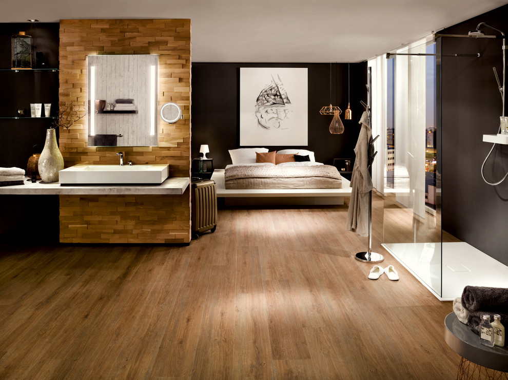 Design ideas for a bedroom in Cologne with brown walls, vinyl floors and brown floor.