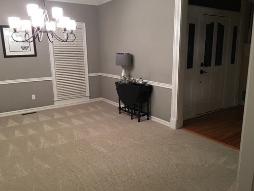 Replace carpet with wood flooring before furniture purchase? - Would the best way forward be to do the wood flooring first? This would  delay furniture purchase/working with a designer for budgetary reasons.